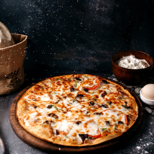 pizza-with-cheese-brown-wooden-surface-bright-surface (1)